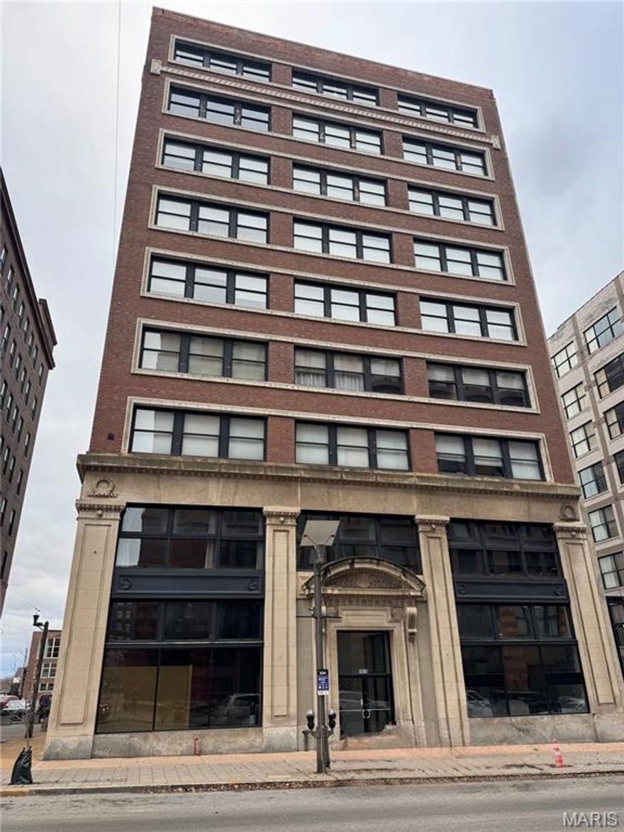 Discover downtown living at its finest in this beautiful 2-bed, 2-bath condo on the 8th floor of the historic Railway Lofts. With 1,680 square feet, this residence blends industrial charm with modern comfort in a way that feels both stylish and welcoming. Lovingly maintained by the same owner for 13 years, it includes tasteful updates like new oak floors, new appliances, and custom window treatments—motorized shades in the primary suite add an elegant touch. Soaring ceilings, exposed brick, and expansive windows fill the space with natural light.

The spacious kitchen is a true centerpiece for entertaining, featuring marble countertops, a large island, 42” cabinetry, and stainless steel appliances, including a brand-new fridge and oven. The open layout flows into a comfortable living area ideal for relaxing, with room to set up a home office between the living and dining spaces. The generous primary suite includes a soaking tub, freestanding shower, and a well-organized walk-in closet, while the second bedroom offers plenty of space. A dedicated laundry room and additional hallway storage add everyday convenience.

Step outside to your wrought-iron balcony for stunning views of the City Museum and the Stan Musial Veterans Memorial Bridge—perfect for evening grilling or unwinding under the city lights. Two indoor parking spaces with a hydraulic lift offer peace of mind, and the Railway Lofts’ well-managed condo association ensures the building is cared for as thoughtfully as your new home. This is downtown living done right—historic character, modern updates, and a layout designed for comfort and style. Come experience it for yourself.