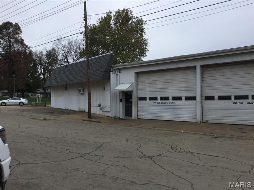 Move or open an automotive business in downtown Farmington with great exposure on the corner of Ste. Geneveive Avenue and Long Street. This building is perfect for automotive work with overhead doors on all 4 bays and 2 lifts in the lower bays.  14 ft high ceiling in the large bay (16 foot in the center).  The lifts are 8,000 and 10,000 lbs.  Lower bay doors are 16ft x 12 ft and upper bay doors are 10 ft x 10ft.  Waiting room is complete with chairs and a counter.  There is a separate office with a desk for work away from the waiting area.  Restroom and a kitchenett are also available off the waiting room.  New gas furnace and electric tankless water heater installed in November/December of 2025.  The roof was replaced in 2015.  There is a covered area off the back of the building with a fence for storage.  There is also shelves, transmission jack and bearing press that will be left with the building.