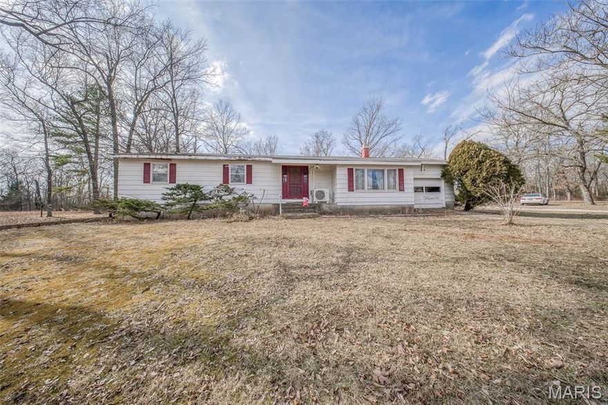 Escape to the peace and privacy of this 3 bedroom, 1 bath home situated on +/- 39.4 acres in Dent County and located in the Dent/Phelps R-III School District. This property offers the perfect blend of comfort and seclusion. An inviting entryway welcomes you inside, leading down into the spacious living room featuring a cozy wood-burning fireplace. The eat-in kitchen provides a warm gathering space, while the separate dining room offers access to the back deck—perfect for enjoying the surrounding views. Laundry is conveniently located on the main level. Generous bedrooms and a full bath complete the main floor. The home sits on an unfinished walk-out basement, offering room to expand or additional storage. Attached 1-car garage plus a detached 1-car garage/workshop provide plenty of space for vehicles, hobbies, or equipment. If you're looking for acreage, privacy, and potential, this is it! Don't miss this opportunity.  Schedule your private showing today!