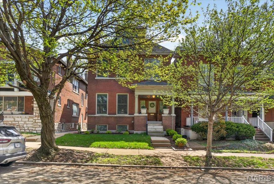 Nestled on a picturesque, tree-lined street in the heart of Tower Grove East, 3516 Magnolia offers a rare blend of historic craftsmanship and thoughtful updates across three finished levels. Rich original millwork, stained glass, and beautifully preserved pocket doors reflect the home’s timeless character and care.

The main level features generous living and dining spaces that flow into an updated kitchen designed for everyday living and entertaining. A covered deck overlooks the fully fenced backyard with refreshed landscaping and mature plantings.

The second floor includes two bedrooms (one currently utilized as a workout room), two full baths, and a newly screened-in porch, creating a quiet, functional retreat. A former fourth bedroom has been transformed into a gorgeous custom walk-in closet. The third floor is dedicated to an expansive bedroom suite with flexibility for additional living, work, or lounge space.

The tidy lower level offers high ceilings, a finished laundry area, abundant storage, and a walk-out to the backyard. Lighting updates throughout complement the home’s historic style.

An architecturally distinctive two-car detached garage completes the property. Just seconds from Tower Grove Park and walkable to myriad neighborhood favorites, this home delivers character, flexibility, and an exceptional location.