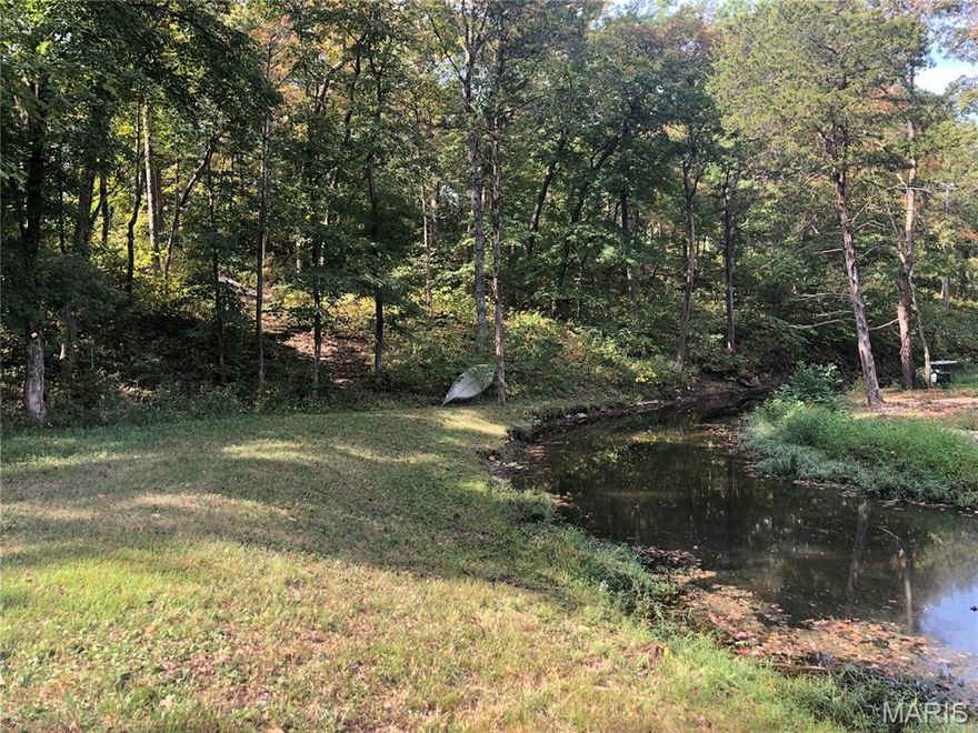 Perfect get away is located in the gated lake community of Cedar Lake.   The .11 acre lakefront lot includes a 2018 Coleman camper that sleeps 8. If camper is not desired in sale, price would be adjusted to $25,000 for just property. RV pavilion & shed. In great condition,  a shed, newer deck  & a solid RV carport.  30 amp electric is available.  Water, Septic not provided.  Water tank and portable  septic included.  Located at the end of the road & framed by a tree filled ridge on one side, creates a nice yard for lake fun.