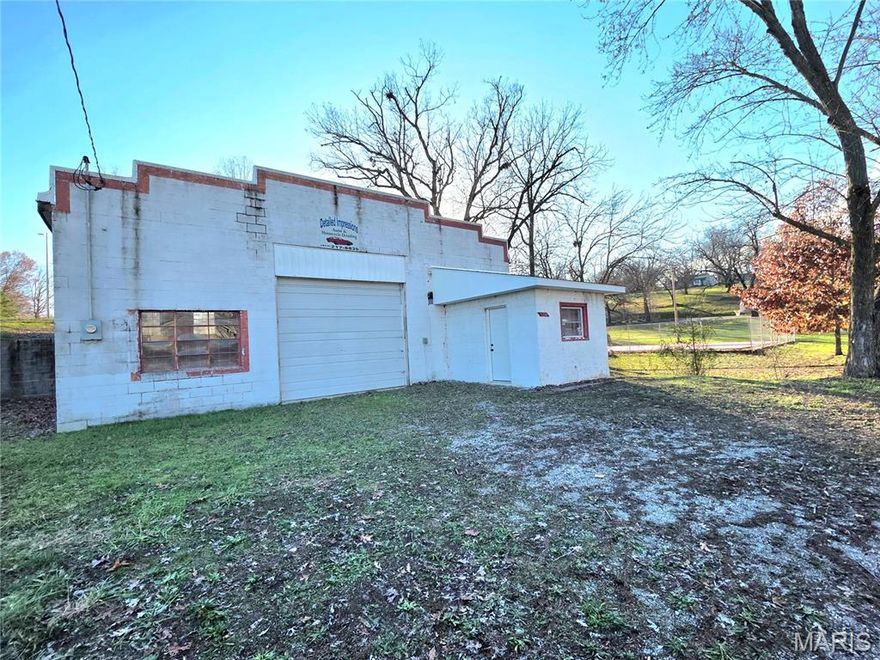 Prime location with endless potential! This commercial building offers excellent visibility, easy access, and flexible space suitable for a mechanic shop, retail or any service-based business! Office area with restroom, loft storage, 15ft ceilings and 10x20 bay door. Lots of possibilities for your future business! Located off of Hwy 63 in Houston on a .37 acre lot.