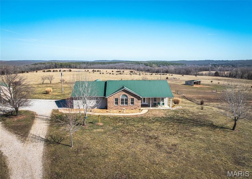 Beautiful home that sits on 16 acres,fenced,crossed fenced, gated, pond, smaller pad lock for cattle/horses. This property adjoins FLW and is less than 2 miles from the national forest. This property offers 1400 SQ shop,14' ceilings,insulated,plumed for bathroom, electric & 220V for welder, oversized 14' door, built-in-workbenches. Dual heat sources-regular heat pump & central cooling,separate system us Hardy outdoor heater that heats house and provides all hot water not connected can be when being used. The shop is also set up for the hardy heater will need to be connected. Above ground pool with the dream custom deck and arbor. Back patio for all your outdoor entertainment needs. The view of the back is stunning! The kitchen has granite countertops, custom cabinetry and beautiful formal foyer. You are only 10 minutes to the back gate of FLW