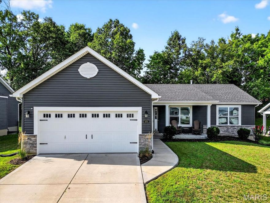 Welcome to Majestic Lakes in Moscow Mills!
This 3-year-old ranch home offers 3 bedrooms, 2 bathrooms, and approximately 1,225 sq ft of thoughtfully designed living space. The open floor plan features high ceilings in the living room, a kitchen with granite countertops and easy-close drawers, and an attached 2-car garage. Fresh new mulch enhances the landscaping, and the backyard patio backs to mature trees, providing shade and privacy. Located in the Majestic Lakes subdivision, residents have access to a community clubhouse and pool. This well-maintained home is ready for its next owner to enjoy!