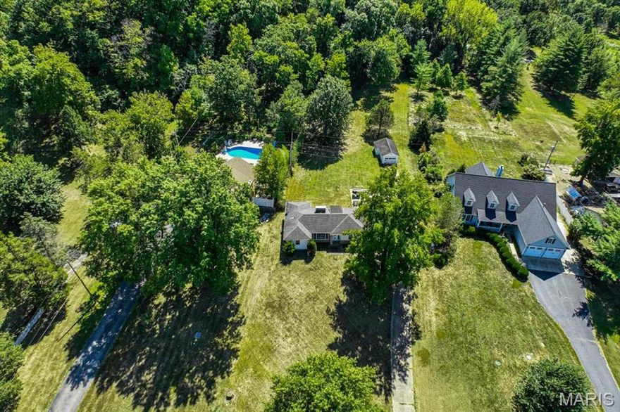 BUILD YOUR DREAM HOME! Imagine owning over an acre of prime land nestled in a lush canopy of mature trees just next to the Meramec River. This lot is also perfectly tucked away just across from the highly sought-after Tapawingo Golf course community and The Vistas at Stone Castle. This picturesque parcel offers the best of both worlds: tranquil natural beauty and unbeatable convenience. Towering, mature trees provide shade, privacy, and a serene backdrop for a retreat or dream home. Yet, you're just a short drive from major highways, putting shopping, dining, and local amenities within easy reach. Lindbergh schools and nearby parks like Laumeier Sculpture Park, Emmenegger Nature Park, Possum Woods Conservation Area, Siren Park (playgrounds, paved nature trails, exercise equipment, ball fields, and sand volleyball) showcase the region’s forested charm and riverfront views. With septic, water, electric and gas already present, you don't miss this incredible opportunity to build the dream home you have always wanted, OR fix up what is already there and call her your own!
This is a duplicate listing.