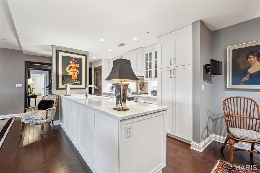 Absolutely stunning condo with incredible views of Forest Park! 2 bedrooms, 2.5 bathrooms, 2,068sqft of living space and secured garage parking spaces(2). Greet guests in large entry foyer w/hand painted walls, marble tile and coffered ceiling. New hardwood flooring throughout living, dining room with coffered ceilings, recessed lighting and a study which features a double-sided gas fireplace and built-in bookshelves. Updated kitchen w/Thermador appliances, custom hood, 5-burner gas range, custom backsplash, dishwasher, quartz countertops and breakfast room. Primary suite w/newer carpet, coffered ceiling, large walk-in custom closet, raised vanity sink, marble flooring, quartz countertop, subway tile walk-in shower & jetted tub. Private second bedroom ensuite includes updated full bathroom w/raised vanity, quartz counter, grasscloth wallpaper, walk-in shower and large walk-in closet. In-unit laundry w/Bosch washer/dryer and designer half bath. NEW interior storm windows & NEW HVAC! Amenities: green terrace w/gas fireplace, 2 Wolf gas grills, community room w/full kitchen, valet parking, concierge, dry cleaning collected/delivered twice/week, on-sight security, storage area, bike room, restaurants(3), movie theater & heated pool! Straub's across the street and walkable to all CWE has to offer!