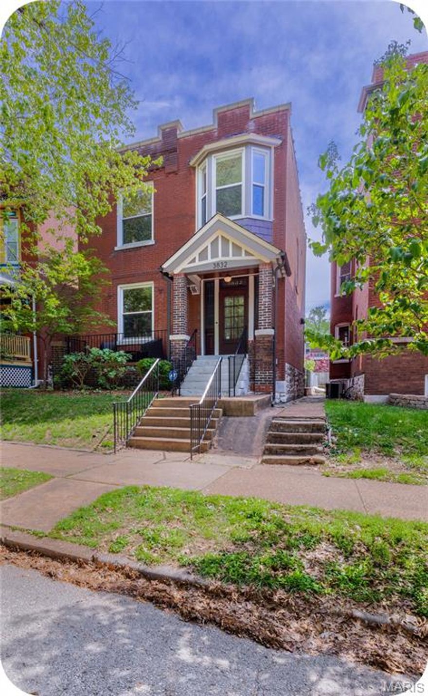 This charming all-brick 2-story in the heart of Tower Grove South is just steps from Tower Grove Park, Morganford favorites, and everything the South Grand district has to offer! This beauty is full of character... step inside the perfectly preserved front door and you'll immediately fall in love with the original hardwood floors and stunning stained glass windows throughout . The open living & dining room is perfect for entertaining. The completely renovated custom kitchen shines with gorgeous wood cabinetry, sleek tilework, and updated appliances—ideal for both everyday living and entertaining. A convenient half bath rounds out the main level, along with a bright and inviting sunroom that’s perfect for morning coffee or a cozy reading nook.
Upstairs offers two spacious bedrooms plus an additional bonus room over the stairs—perfect for a home office, nursery, or creative space. The full bath has been beautifully updated, and second-floor laundry adds everyday ease. Step outside to enjoy the private brick patio and 1-car garage, completing this picture-perfect Tower Grove home...and did I mention there's solar panels on the roof?? A rare blend of charm, updates, and unbeatable walkability—this one is not to be missed!