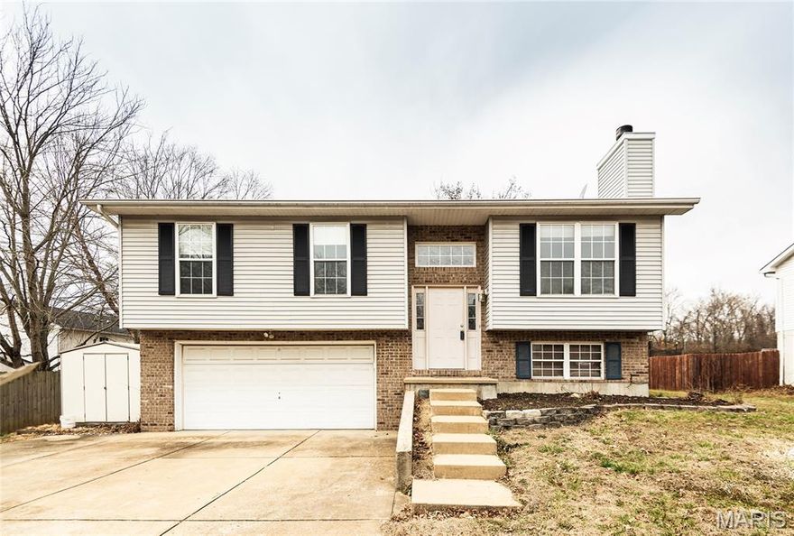 Welcome to 1001 Parc Central Drive in Festus! This freshly painted split-level home offers a bright, open living space with vaulted ceilings and a cozy fireplace. The kitchen features brand-new cabinets and flows into the dining area with access to a large deck overlooking the spacious backyard. The lower level provides additional living space, a full bath, and laundry area, offering flexibility for a family room, office, or recreation space. With a 2-car garage and generous yard, this move-in ready home offers great space inside and out.