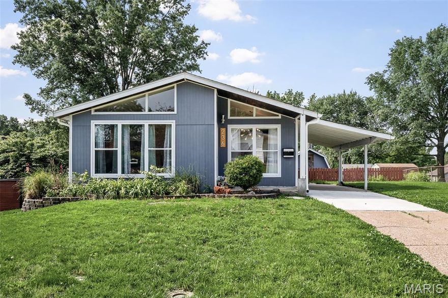 An Uncommon Level of Craft, Detail, and Design, rarely does a property command attention at every turn — this one does. On approach, the custom wood soffit and tongue-and-groove porch signal the level of intention that defines this home throughout. Every upgrade, every material choice, every finish reflects a commitment to enduring quality over fleeting trend. Structural investments speak for themselves: newer siding, roof, gutters, thermal windows, and AC form a comprehensive envelope of efficiency and protection — complemented by a 200 AMP electrical upgrade and the rare distinction of a Solar Trom Wall, whose seasonal sail harnesses winter sun and casts summer shade with elegant precision. Inside, the kitchen and bathrooms read as curated collections rather than mere renovations — artist-crafted elements, reclaimed and live-edge wood vanities, custom flooring, and dual showerhead showers woven together with floors of rich hardwood, Travertine, and marble tile. Designer lighting adds warmth and dimension throughout. The walk-out lower level unfolds into its own sanctuary — a private primary ensuite, a quiet home office, an expansive family room, and a laundry suite that redefines the word utility. Every square foot has been thoughtfully considered. Step outside to grounds that extend the home's sense of care: perennial flower beds cascade along retaining walls, a rear walk-out patio opens to a sweeping lawn, and a bespoke 12×12 shed — with 8-foot ceiling, a finished loft, and private balcony — stands as a property unto itself awaiting your personal final use decision.