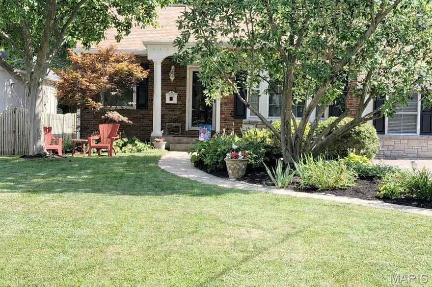 Storybook Kirkwood cottage in prime location in Jefferson/Argonne historic district  Expanded and updated with  a delightfully open floor plan, cathedral and coffered ceilings, wood floors, built-in bookcases, arched doors and decorative fireplace, and sunroom that opens to the maintenance free deck, large, private backyard and newer garage/carriage house! Main floor primary suite with private ensuite bath. lower level is partially finished. Enjoy Kirkwood at its best, walk to restaurants, shops and the Kirkwood Farmer's Market. Also enjoy the Kirkwood Community Center, pool and park.  Top rated Kirkwood School District! Photos in MLS 3/7, Showings begin Thursday 3/12,  Brand new roof being installed on house and garage 03/18-19