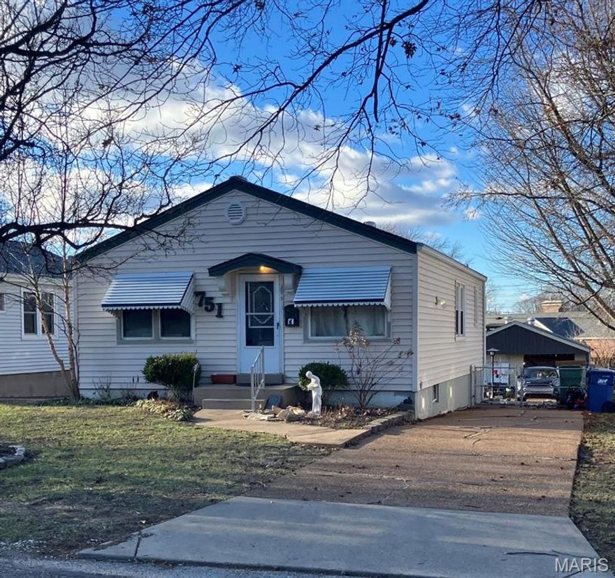 Welcome home to this Bella Villa two-bedroom, one-bathroom home. Potential galore with original wood floors, adorable sun porch, and a partially finished walk-out basement with additional sleeping area. Enjoy the large backyard and two-car detached garage. Property to be sold as-is.