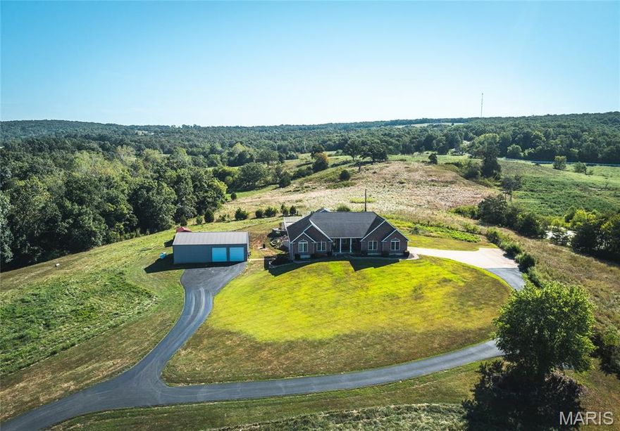 Spacious four-bedroom, three-bath all-brick home offering over 3,000 sq. ft. of finished living space, set on 4 acres that feels very private. Inside, you’ll find custom-built cabinetry throughout the bathrooms, kitchen, desk area, and utility room. The kitchen and master bath feature beautiful granite countertops, while the formal dining room provides the perfect space for entertaining.

Step outside and enjoy your own private oasis with an 18x36 in-ground pool, complete with a pool house and fenced pool area. Relax on the 650 sq. ft. of covered side and back deck or take advantage of the artesian well supplying the property. A geothermal heat pump ensures year-round efficiency.

For the hobbyist or professional, the 32x50 heated and cooled shop is a dream, featuring a 12x50 lean-to off the back for additional storage. A convenient 10x10 yard shed adds even more utility. The home also includes a spacious two-car garage for everyday convenience.

This property offers the perfect balance of comfort, function, and privacy—luxury living surrounded by peace and space.
