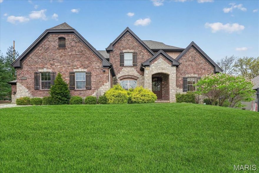 A refined expression of modern living, this 11-year-young residence offers the ease of a true lock-and-leave lifestyle without compromising scale or sophistication. Ideally positioned within the Ladue School District, just moments from premier schools, major thoroughfares, and the area’s finest shopping and dining, the home delivers exceptional convenience for today’s dynamic lifestyle. The light-filled interior is defined by a flexible, thoughtfully designed floor plan. Architectural details—including hand-scraped hardwood floors, soaring 9’+ ceilings, and graceful curved wall construction—create a sense of thoughtful design throughout. The vaulted great room centers around a striking double-sided gas fireplace with stone surround, offering a seamless transition between formal and casual living spaces. The eat-in kitchen is designed for both everyday ease and elevated entertaining, featuring a large island, top-tier stainless steel appliances and a natural flow to the butler’s pantry, breakfast room, and hearth room. The main-level primary suite serves as a private retreat, complete with a generous walk-through closet and a spa-inspired bath with dual vanities, soaking tub and separate shower. A secondary main-floor suite provides versatility for guests, a home office, or multigenerational living. Upstairs, three ensuite bedrooms are complemented by an expansive family room or media lounge. The lower level offers a finished recreation space with ample opportunity for customization, while three-car garages, mudroom, and dedicated main-floor laundry enhance everyday functionality. A rare opportunity to own a newer, low-maintenance home in one of St. Louis’ most sought-after locations—where luxury, convenience, and effortless living align.