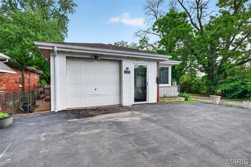 From the moment you arrive, you’ll appreciate the large driveway and attached one-car garage, offering convenient parking for up to four vehicles. The inviting front entrance features an adorable enclosed mudroom, perfect for kicking off shoes before stepping into the warm and welcoming living/dining room combination.

Inside, you’ll find thoughtful updates throughout, including newer windows that create a quiet, comfortable atmosphere. The living room is accented by a charming faux fireplace, adding character and coziness. The updated kitchen showcases freshly renovated cabinetry and a stylish wood-look tile floor that flows seamlessly through the kitchen into the hallway, with real wood floors in all three bedrooms. Kitchen includes the refrigerator, gas stove (as is, large oven works but smaller oven doesn't for some reason) and dishwasher.

The main floor offers three nice sized bedrooms and a full hall bath. A convenient side entrance off the kitchen provides flexible access—either directly into the home or down to the finished lower level, which can function as a completely separate living space.

Downstairs, you’ll find a fully equipped apartment featuring two bedrooms (both with egress windows and closets), a full kitchen w/refrigerator and electric stove, bathroom, and cozy family room. Whether used as a rental, guest quarters, or private retreat for teens, this space offers endless possibilities.

Step outside to enjoy the fully fenced backyard, ideal for pets, play, or entertaining. Included is a 4 person jacuzzi, works perfectly and stays for your enjoyment. There is also a barely used sump pump in the shed that can be used in one of the egress window wells in the basement, but has not been needed. The 2 sheds will stay, as well as the well stocked wood pile and fire pit.

Additional Notes: Property lines run along the existing fence. Please note, the driveway to the right of the property belongs to the neighboring home behind—parking is permitted only in front of the subject property.