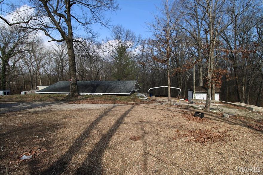 $90,000. 137 E Lexington Ave. 3 bedroom, 2 bath earth-bermed home with concrete slab foundation. 1 acre lot +/-. Shop building with electric, three storage sheds, mostly-fenced backyard. Double carport. Nice brick fireplace. Home needs cosmetic repairs. Sold as-is. 1440sf +/-,