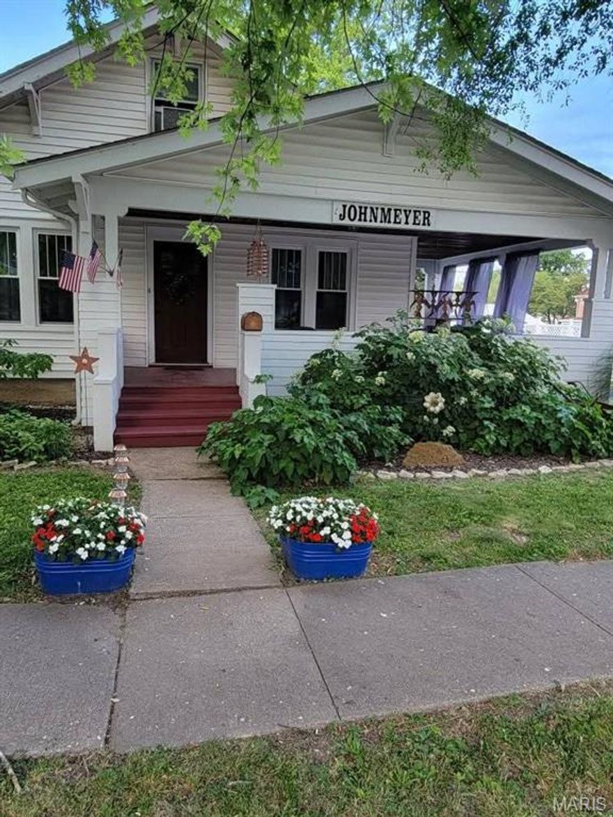 Lovely 1910 Craftsman home. Very well maintained, with many additional things added since 2017. Vinyl siding, vinyl clad tilt windows. The laundry was moved from the kitchen to a back bedroom (could be a bedroom again, if needed.) Huge pantry added. Tile in the bathroom and new vinyl in the kitchen. Lots of closets, big basement and an attic for storage. The garage is extra deep with shelves and work bench. Beautiful wood floors in almost all rooms. Many craftsman details in the doorways. The gorgeous wrap around porch (my favorite spot) and back porch have a tongue and groove ceiling. I had the 'she shed' built in 2017 for fun, had many meals and card games out there. It's historical also. The front facade is from an 1860's cabin, the screens from an 1860's Stark mansion. The 2 triangular windows from a carriage house from a Stark farm. It has electric. I also added the gravel for extra parking in the back. Vinyl siding in 2018, all new vinyl tilt in windows in 2018.  New insulated garage door in 2020.            
My average monthly Ameren bill for gas and electric in 2025 was$145.