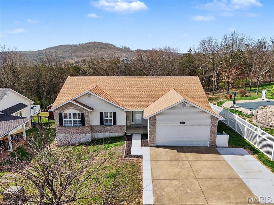 Welcome to 2525 Castle Pines Drive!  This beautifully maintained ranch home offers comfort and convenience with the added value of a brand new roof! Featuring 3-bedrooms and 3 bathrooms, this home features an open, airy layout which includes vaulted ceilings, new light fixtures, large windows for loads of natural light, fresh paint and a main floor laundry.
This home also has newly added extended off-street parking, which offers convenience for multiple vehicle households or guests. The walk-out basement provides incredible flexibility, complete with a full kitchen, full bathroom, gas fireplace, living space and sleeping area. All of this extra finished space is ideal for entertaining, multi-generational living, or a private guest area.
You will no doubt enjoy the large, .42 acre wooded, fenced lot that offers both privacy and a peaceful, natural setting. This home has it all- don’t miss the opportunity to make it yours!