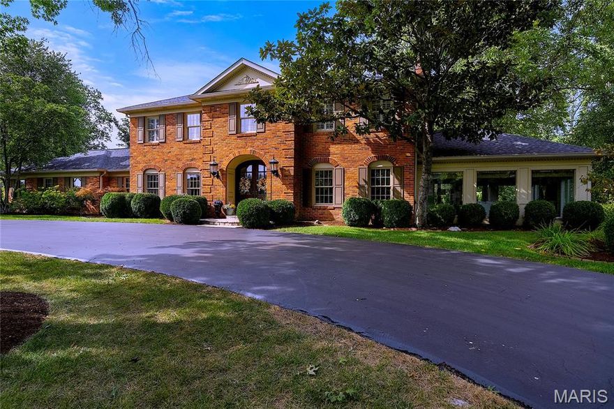 Discover livable luxury. Magnificent Town & Country manor offers seamless blend of comfort, style & sophistication—perfect for relaxed family living & upscale entertaining. This elegant residence showcases 9-ft ceilings, an inspired color palette, polished parquet & an abundance of natural light. Flanking the entry, formal DR dons ice blue Thibaut grass-cloth, high-gloss trim, well-dressed windows & tres chic chandelier. Across the hall, gracious LR hosts marble FP & atrium doors to sunroom clad in pure white w/contrasting tray ceiling, brass chandelier, walls of windows & access to garden path. Spacious open kitchen w/custom maple cabinetry, Corian counters, premium appliances & granite center island adjoins sun-lit breakfast room w/ built-in sideboard & sea-shell chandelier artistically cascading from tray ceiling. Vaulted solarium leads to box-beam study w/wide bay window, limestone FP, built-ins & art gallery. Revel in sumptuous primary suite w/FP, lavish bath & WIC. Completing 2nd flr. living quarters, 3 generously-sized bedrooms & dazzling hall bath. Daily life runs smoother courtesy of butler pantry, main-flr laundry & the prettiest of powder rooms. Add, prof fin. LL, newer roof, 3-car gar & circular drive. The highlight: resort-style sparkling pool, charming pool house, stone FP, veranda & lush acre lot. Whether you're soaking up the sun, hosting weekend gatherings, or enjoying a quiet evening swim, this private outdoor oasis is sure to impress. Yes. This is the life!