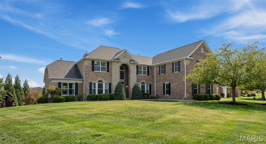 This one-of-a-kind home is not something you want to miss out on! Situated in the beautiful Tapawingo subdivision, this home has undergone major updates throughout. With 6 bedrooms , 6.5 bathrooms, and over 6900 square feet of living space, there is plenty of room for a large family. Upon entering the two-story foyer, you'll have a formal living room to your left and a dining room to your right with tray ceilings. A stunning two-story great room features a wall of windows that overlook the pool area. Your dream kitchen was just completed in 2024 with designer two tone white and blue inset cabinets, WOLF and Subzero appliances, and all the luxuries you can imagine. A full walk-in pantry with custom cabinetry will keep your meals organized. The hearth room has a full wall of doors that open to an outdoor living space that is magazine worthy. The upstairs was expanded to create a total of four ensuite bedrooms, an additional playroom/office, a laundry closet, and an upstairs living room. The primary suite is situated on the main level featuring a spacious bathroom with his and hers vanities and closets. Retreat to the lower level to find another great space entertaining guests with endless possibilities. There is an office with a custom built in desk and credenza for any of your work from home executives. The lower level opens up to a spacious patio and outdoor pool area. The pebble sheen infinity edge pool is your own private oasis to enjoy those hot summer days.  Relax in the hot tub or fireside on those cooler evenings. In addition to the amazing features of this home are the amenities of the area. You're just a few minutes from highway access, local parks, shopping, or a round of golf at the 27-hole, Gary Player designed, Tapawingo Golf course.