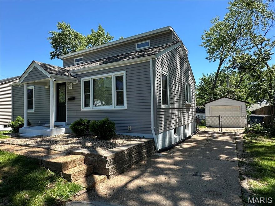 Discover this beautifully updated 4-bedroom, 2-bathroom gem in Overland, Missouri. About 2,000 sq ft of finished living space. The home features a bright, open living space. Kitchen boasts wood cabinets, all new stainless steel appliances: electric range, slim microwave, dishwasher and refrigerator. Separate dining room is perfect for family/guests gathering. Basement is fully finished and is waiting for your decorating/entertainment ideas. Special features: ceramic tile; laminate, vinyl, wood flooring, recessed  lightning, stylish back splash, modern entry door, warm pastel colors.  Enjoy a deck off kitchen and a private, fully fenced  backyard.  Located in a friendly neighborhood, close to schools, parks, and shopping. Brand new roof. Don't forget a garage.   A must-see property!