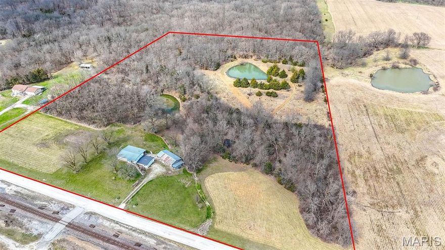 One-owner home of 50+ years on 15+ acres! This hard-to-find property offers 4 bedrooms (1 non-conforming), 3 bathrooms, a walk-out basement, a large attached garage, and a huge lean-to. Major updates within the last 8 years include the metal roof, HVAC, water heater, siding, windows, and gutters, giving buyers peace of mind on many of the big-ticket items.
Inside, the living room is filled with natural light and flows nicely into the dining area and kitchen. Just off the kitchen, you'll find the sunroom, where the views are absolutely beautiful, while the covered back deck provides the perfect place to relax and take in the peaceful setting. The main-level primary suite offers a full bathroom with a walk-in shower and a spacious walk-in closet.
Two additional bedrooms and another full bathroom are also located on the main level.
Downstairs, you'll appreciate the workshop space, a bonus room, and a large non-conforming bedroom paired with a full bathroom.
Outside is where this property truly shines. You'll fall in love with the 1-acre stocked pond filled with bluegill, bass, and channel cat, the abundance of wildlife, and the fact that the property backs to conservation land. You'll also enjoy the fresh peaches from the peach trees! 
While the home could benefit from some cosmetic updates, the opportunity here is undeniable with so many of the major improvements already completed. This is a rare chance to own a well-loved property with acreage, water, views, and incredible outdoor enjoyment!!!