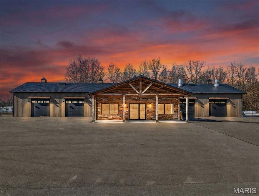 Exceptional commercial opportunity featuring a 9,000+ square foot building situated on approximately 2.75+/- acres with major highway frontage for maximum visibility and accessibility. This impressive property is less than two years old and was thoughtfully designed to accommodate a wide range of commercial and industrial uses. The building offers multiple private offices, a functional kitchen area, and expansive shop space with high ceilings and multiple 14'x14' garage doors and one 20'x20' garage door, providing excellent clearance for large vehicles, equipment, and operations.  A compressed air system runs throughout the building, enhancing efficiency and workflow. The back portion of the main structure includes container storage and a partially fenced area for secure outdoor storage or equipment staging. The hard surface parking area allows for ample employee and customer parking, as well as easy maneuverability for trucks and trailers. With 2.75+/- acres of ground, highway exposure, modern construction, and high-end improvements already in place, this property offers an outstanding opportunity for an owner-user or investor seeking a turnkey commercial facility in a prime location.  Paint booth and additional acreage in back excluded but available upon request. Acreage is approximate; survey to govern.