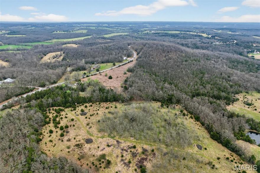 Location, Location, Location. Discover 23 acres of raw Ozark beauty where rolling natural grasses meet mature timber, offering a balanced landscape that’s ready for your vision. A peaceful pond attracts wildlife and adds to the property’s quiet charm. Whether you’re considering livestock, recreation, or a future homesite, this is worth a look.  Left in its natural state, this land gives you the freedom to create exactly what you’ve been looking for—your own slice of country living. Less than two miles down a paved highway from I44 exit 140. This is a fort-friendly property with easy access to Fort Leonard Wood.