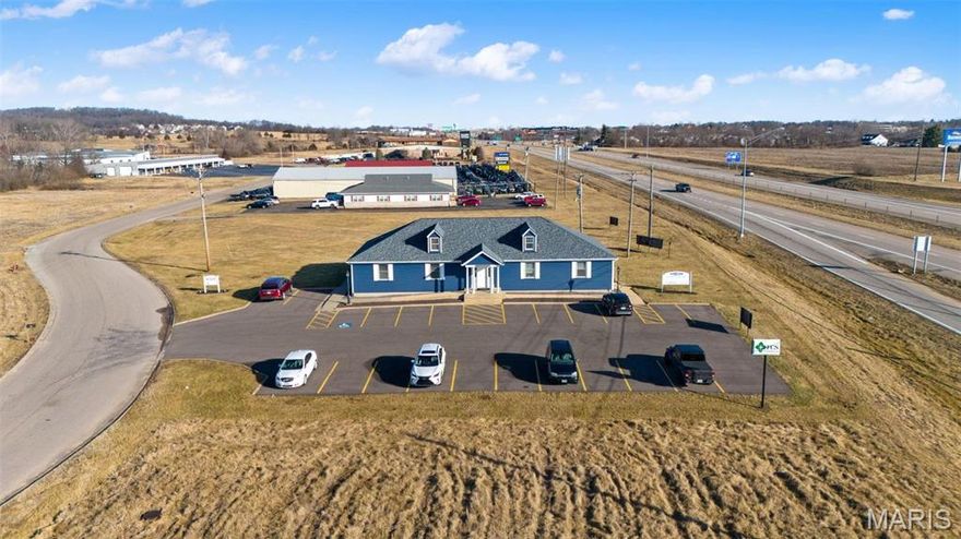 Commercial property in very high traffic area with great visibility from Hwy 67! This property features 3200 sq ft office building with full finished basement. 10 individual offices, 2 conference rooms, 2 kitchens and plenty of parking all on 1/2 acre for future expansion. Building is divided into 2 separate offices and comes with a long term tenant and current owner would look to lease back a portion. New siding, roof, and recently sealed parking make this a great long term investment! Location: High Traffic