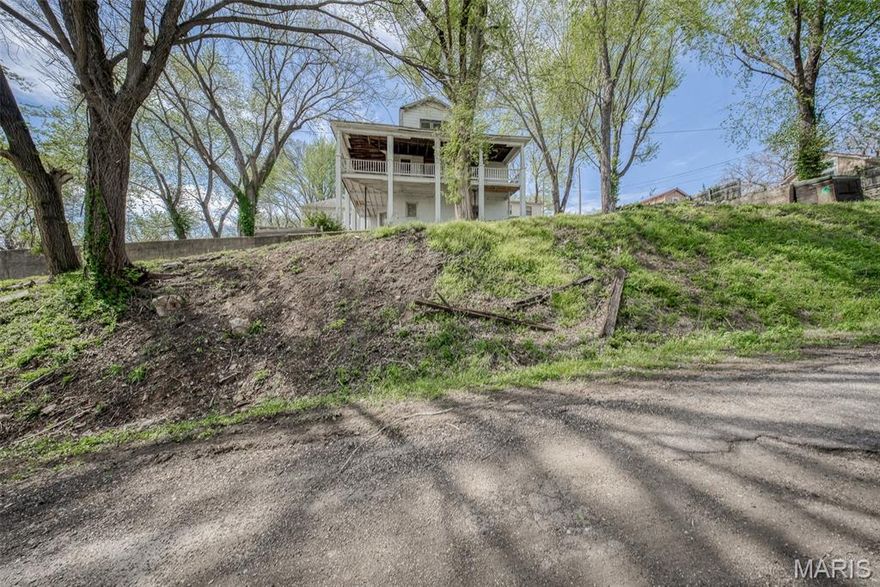 Perched proudly on a hill in the heart of Newburg, this stately 1.5-story home offers timeless charm paired with extensive recent upgrades and endless potential. Featuring 4 bedrooms and 2 bathrooms, the home welcomes you with a spacious open-concept living room and kitchen, complete with a cozy freestanding wood-burning stove—perfect for gathering on cooler evenings. Step outside to the expansive wraparound porch and take in the breathtaking views of the river valley below, an ideal setting for relaxing or entertaining. Major improvements provide peace of mind, including a fully updated electrical system with a new 200-amp service, weatherhead, meter box, and all new wiring on the main level, plus a separate breaker panel for the upstairs. The upper level has been completely gutted, fully insulated to R-30, features brand new windows, a whole-house exhaust fan, and is partially finished with one room drywalled and two additional rooms ready for completion. Additional upgrades include new plumbing throughout, new Schedule 40 sewer lines connected to the city main, brand new stove and dishwasher (plus an additional dishwasher in the mudroom), as well as a washer, dryer, and new toilets in both bathrooms. A large unfinished basement offers even more space for storage or future expansion. With its stunning setting, substantial updates, and room to make it your own, this home is ready for your finishing touches.  Don't miss this opportunity! Schedule your private tour of this timeless property today!