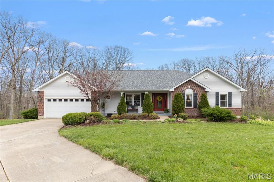 Welcome home to this beautifully maintained 3 bed, 3 full bath ranch nestled on 3 private acres in sought-after Foristell in Wentzville School District! From the moment you arrive, you’ll appreciate the peaceful, wooded setting, long driveway, and additional outbuilding—perfect for storage, hobbies, or a workshop. Inside, the home offers a warm and inviting layout with laminate flooring, a vaulted great room with stone fireplace, and abundant natural light throughout. The updated kitchen features white cabinetry, granite countertops, stainless appliances, center island, and opens seamlessly to both dining and living spaces—ideal for everyday living and entertaining. Convenient main floor laundry adds to the ease of one-level living. The spacious primary suite offers serene backyard views, a large walk-in closet, and an gorgeous updated bath with dual vanities, soaking tub, and separate shower. With 2 Additional main floor bedrooms and full bath provide flexibility for family, guests or home office. The finished lower level expands your living space with a large rec area, bar, full bath, and dedicated media space—perfect for entertaining. Step outside to your private retreat featuring a covered patio, extensive paver patio space, and a cozy firepit area surrounded by mature trees—an ideal setting for relaxing evenings or gatherings. This rare combination of space, privacy, and functionality with modern updates makes this property a must-see!