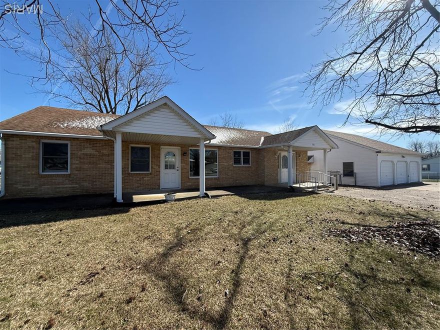 2 bed, 2 full bath home with tons of potential! Features a spacious primary suite with private bath and a bright sunporch overlooking the backyard. Large fenced yard and a 3-car garage with heated workshop, attic storage, and bath rough-in. With a little TLC, this one could really shine!