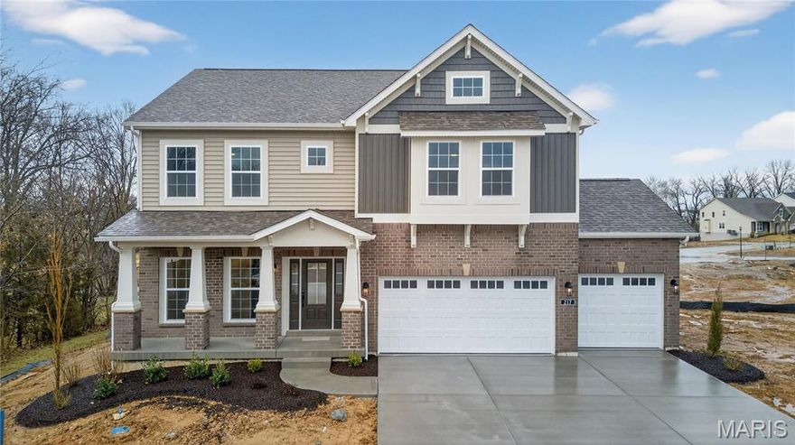 Welcome to this new 2-story home by Consort Homes in Prairie Bluff offering 2,892 sq. ft. of living space. The main level features LVP flooring throughout the family room, living room, dining room, kitchen, and breakfast room. The family room includes a window wall, gas fireplace, and ceiling fan. The kitchen offers staggered cabinets with glass mullion accents, crown molding, roll trays, decorative panels, soft-close features, dovetail construction, full-extension drawers, two-tone cabinetry, quartz countertops, stainless steel gas appliances, a refrigerator cabinet, island, and pendant lighting. The upper level includes a bonus room, laundry room, and four bedrooms. The primary suite features a 16x19 bedroom with ceiling fan, walk-in closet, and a bath with double wave-bowl vanity, freestanding tub, and upgraded hardware. Secondary bedrooms include bracing for future ceiling fans. Additional baths feature wave-bowl vanities and LVT flooring. The home includes a walkout basement with rough-in plumbing, sump pump, and concrete construction. Exterior features include brick veneer, vinyl siding, composite deck (14x14), concrete patio (12x12), and landscaped yard. Three-car attached garage with opener, concrete driveway, and coach lights.