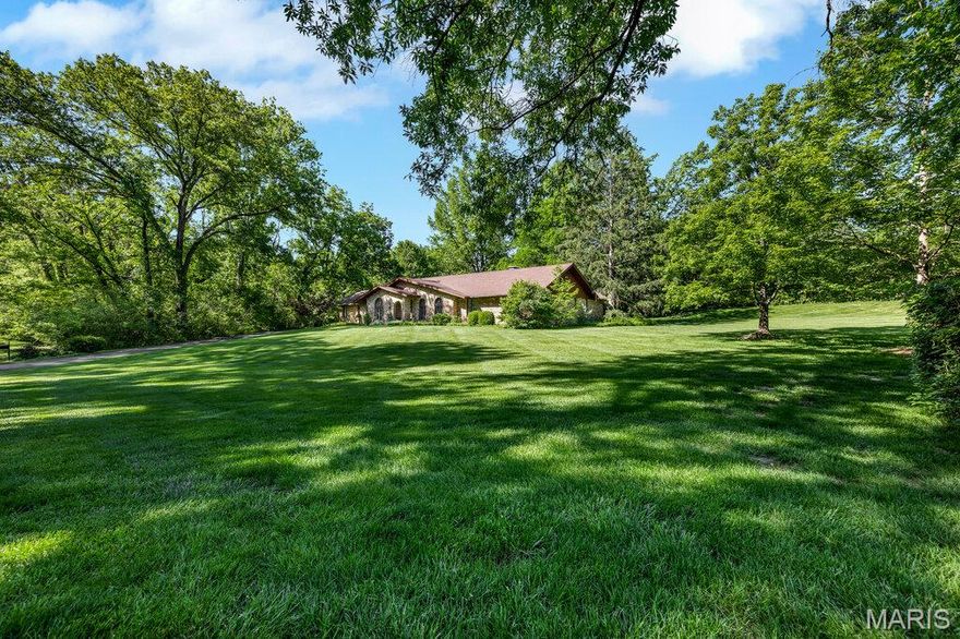 Prestigious location, incredible lot, and meticulously maintained ranch on 2-acres. An exceptional opportunity to personalize or reimagine this sprawling ranch on a beautiful, level, park-like lot complete with 4 car garage. Located in a highly sought after neighborhood, the home boasts hardwood floors, spacious living spaces, expansive primary suite, finished lower level, and extensive storage with room for all your hobbies. Large kitchen, family room and primary suite all open to large patio overlooking idyllic yard. With unmatched flexibility for expansion, this cared for home offers peaceful privacy on outstanding acreage, while being just minutes from shopping, dining, highways and everyday conveniences.