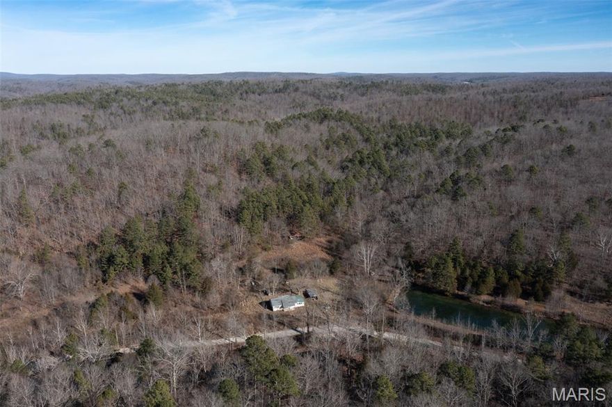 Have you been dreaming of a prime building location that's secluded, picturesque, has creek frontage, and not just one, but three spring fed ponds?  Well, dream no more!  This 53.2 Acre tract has unbelievable potential and more than one perfect spot for your forever home.  Electricity is onsite and ready to be connected once you finish site preparation and are ready to begin construction.  If you're a wildlife enthusiast, this place is paradise personified!  Natural springs populate the property, which not only provide one of the finest fresh water sources for drinking, but keeps the whitetail deer coming back for more!  The views are magnificent, and while you're tucked away in solitude, you're only minutes from Highway N and 67 - living just can't get any better than this!