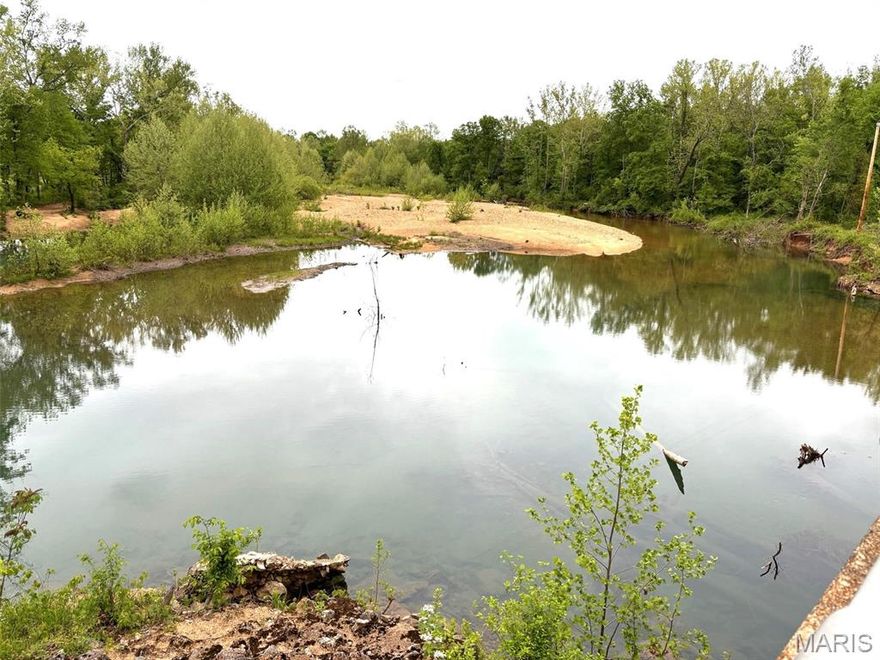 Discover the freedom of wide-open space where you can ride horses or ATVs on miles of trails, fish in your private stocked pond, or unwind beside a clear rock-bottom creek—all tucked just off pavement with complete privacy and no homes in sight.  This energy efficient, 2-story home has hardwood floors throughout, 2 large bedrooms upstairs, primary bedroom and bath on main level, lots of windows, large kitchen w/quartz countertops. Mudroom w/ 1/2 bath!  The 24x 32 Great Room has soaring ceilings & is connected to the home by a breezeway; use as a bonus living space, garage, or workshop. Full basement w/safe room. 64x84 custom horse barn w/runs; 9 stalls, 3 foaling stalls-each w/elec drops, sep. tack & feed rooms, LED lighting; 40x84 indoor riding arena, perfect for year-round training. Pastures securely fenced w/woven wire & electric. Separate pasture w/10x20 loafing shed. 3 Ritchie waterers & 9 winter hydrants.  24x40 shop/garage, & 80 x 24 6-bay equipment shed offer tons of storage space. Private well & septic.  Beautiful home, LIVE water-Big Creek, Custom Barn, Pastures, Outbuildings, Pond, Spring, Woods, & Trails, The Ultimate in country living—an hour to Poplar Bluff or Farmington & 20 minutes to Fredericktown.  Offered with 100 acres m/l with additional land available.