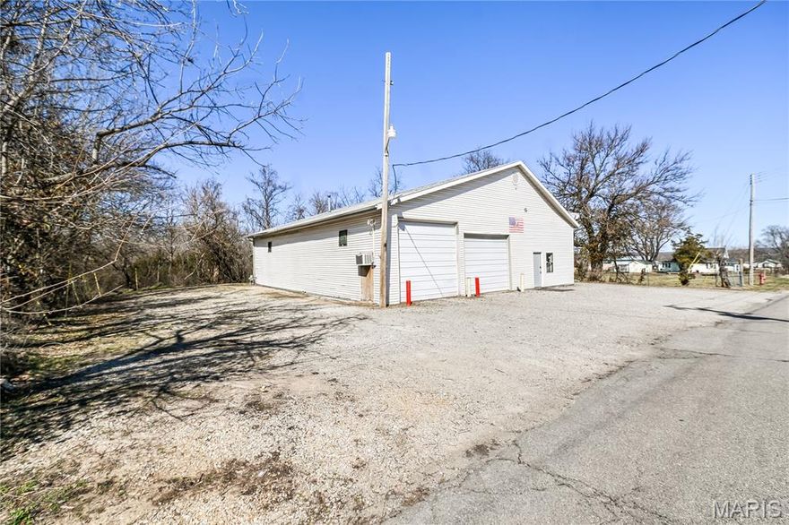 This versatile 2,300 sq ft commercial property offers a practical layout suited for a wide variety of business needs. Formerly a fire station/house and later home to a local kids’ wrestling organization, the space carries a unique history along with a super flexible functionality. The front portion includes private offices, a full bathroom and a full kitchen, storage , and a large meeting room/lobby area that works well for client meetings, team space, training, or group activities. In the back, you’ll find a large 2-bay shop with 220 electric, a floor drain for easy cleanup, and two insulated, overhead doors (12x10 and 12x12) providing convenient access for equipment or vehicles. Located on the northern outskirts of Lebanon, this property offers easy access while still maintaining space and privacy. There is ample on-site parking, making it convenient for employees, clients, or event use. The combination of office, meeting, and shop space makes this a strong fit for contractors, service-based businesses, recreational organizations, or anyone needing a flexible layout with room to operate. Properties like this one do not come along often - so schedule your showing today before it's gone!
