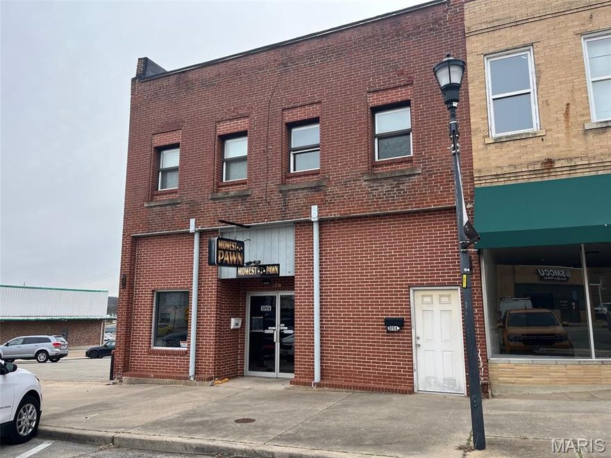 Prime mixed-use commercial building featuring an established retail storefront (currently operating as a pawn shop) with excellent visibility and steady foot traffic. The main level offers a spacious, open retail floor plan with secure display areas, office space, and storage.
The upper level includes two income-producing residential rental units, providing consistent cash flow and added investment value. This versatile property is ideal for owner-operators or investors seeking a turnkey opportunity with multiple revenue streams.
Conveniently located in a high-traffic area with ample parking. Don’t miss this unique chance to own a well-maintained, income-generating property with strong potential.