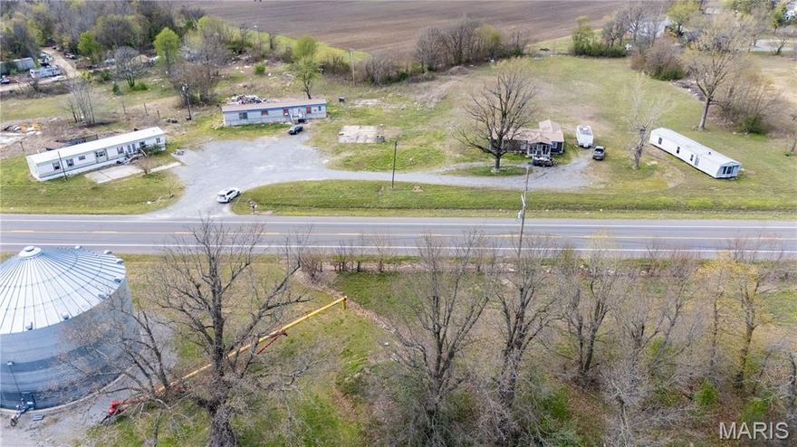 Large lot right outside of town that could be residential or commercial property!  There are currently 4 mobile homes on the property.  Total acreage is 3.34 acres right off of Highway 105!!!