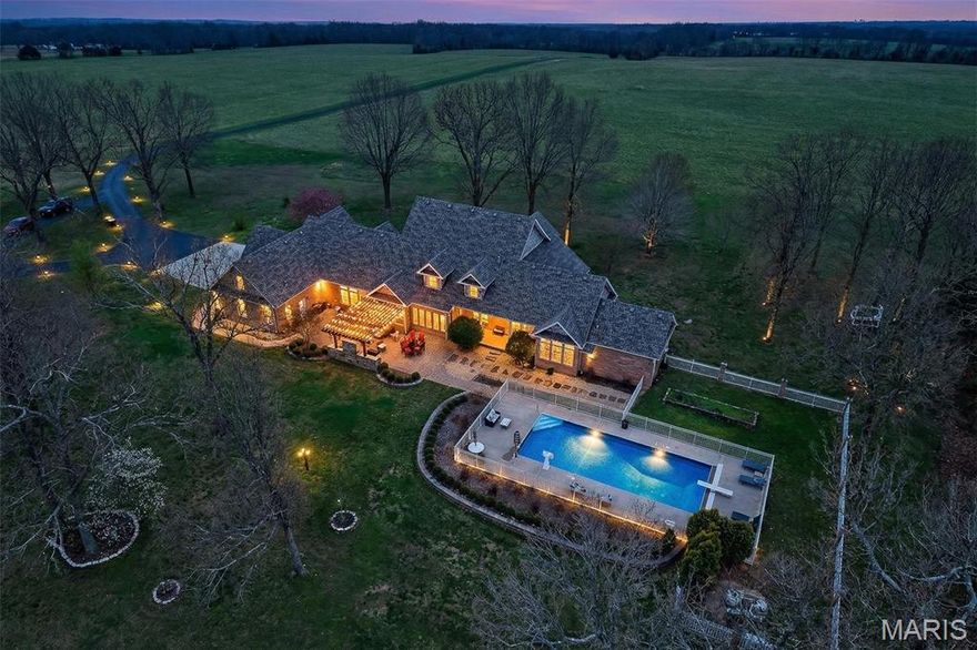 This stunning, country estate sits on 5 beautiful acres with panoramic views for days. The massive home features over 6,400 finished square feet, 10’ ceilings, geothermal heating & cooling, 6 bedrooms (4 with walk-in closets & private baths), and 5 full & 2 half baths. Beautifully refinished hardwoods, gas fireplace, sunroom & built-ins are extras you’ll love. The kitchen reno includes stunning granite countertops, glass tile backsplash, pot filler, sleek new appliances, & walk-in pantry. The master suite checks ALL the boxes, including double sinks, soaker tub, and 2 massive walk-ins with luxury organizing systems. The spacious upper level offers 3 bedrooms, 2 full baths, and walk-in attic storage. The finished basement allows you to entertain a crowd, including a wet bar, guest bedroom, bath, and ample storage. The back patio is where the real magic happens, featuring a well-equipped outdoor kitchen, a pergola, and a heated in-ground pool with a 9’ deep end and an auto safety cover. A 3-car garage with separate workshop space & a full bath completes the home. A brand-new roof, Anderson windows, an invisible pet fence, an in-ground sprinkler system, & a deluxe security system are bonuses you’re sure to value! This layout would work very well for multi-generational living as well. THIS is luxury living in a rural setting; the kind of DREAM HOME you don’t often find. Schedule your private viewing today.