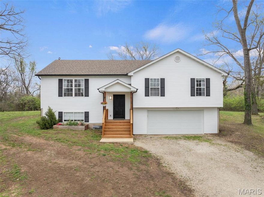 Welcome to your ultimate 2-acre retreat! Nestled along a picturesque, quiet road, this charming 3-bedroom, 2-bathroom home offers the perfect blend of country serenity and modern convenience. Sitting on a sprawling, level lot, this property is a rare find for those seeking space, privacy, and true freedom. One of the most significant advantages of this property is that there are NO HOA fees and NO restrictions. This is a "bring your dreams" kind of property—whether you want to build a massive detached workshop, start a hobby farm with chickens and a garden, park your boat or RV, or simply enjoy the wide-open space without a neighbor in sight, the choice is entirely yours.

This home is truly move-in ready, with all the major "big ticket" items already addressed. The exterior features a newer architectural-grade roof, brand-new siding, and new gutters, providing a sharp, modern look and excellent protection for years to come. The mechanicals have been just as meticulously maintained, featuring a newer well and a whole-house water filter system, ensuring you have consistent, high-quality water throughout the home.

Inside, you will find a bright and inviting atmosphere that feels like a fresh canvas, having been professionally painted just last year. The functional floor plan is designed for easy living, with a kitchen that features newer appliances and plenty of workspace. For a truly seamless transition, the washer and dryer stay with the home, making it one less thing to worry about on moving day.

The outdoor living spaces are where this property truly shines. You can start your mornings with a quiet cup of coffee on the inviting new front porch, which captures the peaceful views of the surrounding area. For entertaining, the brand-new back deck and large patio offer the perfect stage for the ultimate summer BBQ or evening fire pit. The expansive 2-acre lot is mostly level, offering a rare amount of usable land for gardening, play structures, or future additions like a pool or outbuilding.

Located in a fantastic area served by the highly-regarded Nike Elementary School, this home perfectly balances peaceful rural living with easy accessibility to local amenities and highway access. It is the ideal spot for someone who wants the peace and quiet of the country without sacrificing a manageable commute.

Meticulously maintained and updated with care, this property offers a level of freedom and quality that is increasingly hard to find. Properties with this much acreage and this many significant updates at this price point don’t last long. Don’t miss your opportunity to own a piece of the country where you can truly live on your own terms. Schedule your private showing today and come see the charm and freedom for yourself!