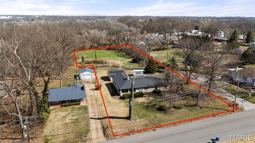 A rare find of a property that truly opens the door to endless possibilities. Tucked just minutes from I-170, this unique opportunity offers effortless access to Clayton, the airport, and major highways—making everyday living and commuting incredibly convenient while still enjoying the space and privacy that’s nearly impossible to find this close in. Set across two parcels—3666 McKibbon and 8623 Hilleman—this property spans an impressive 2 acres. The main home sits on one parcel, while the additional one-acre lot at 8623 Hilleman is a blank canvas ready for your vision. Whether you’ve been dreaming of building a second home, creating a private family compound, developing for resale, or simply holding as an investment, the options here are wide open. The home itself blends character and thoughtful updates with a cool mid-century design that stands out from the ordinary. Inside, you’ll find 4 bedrooms and 2 baths, including a spacious owner’s suite, along with a welcoming layout centered around a cozy fireplace. The updated kitchen features granite countertops, and recent improvements like a new roof and solar panels and all new doors and windows mean added peace of mind and impressively low electric bills. A two-car garage, expansive outdoor space, and the flexibility of two full acres make this property something you simply don’t come across often—especially in such a prime location. Whether you’re looking for a move-in ready home with room to grow or a property with serious upside, this is one that invites you to imagine what’s possible.