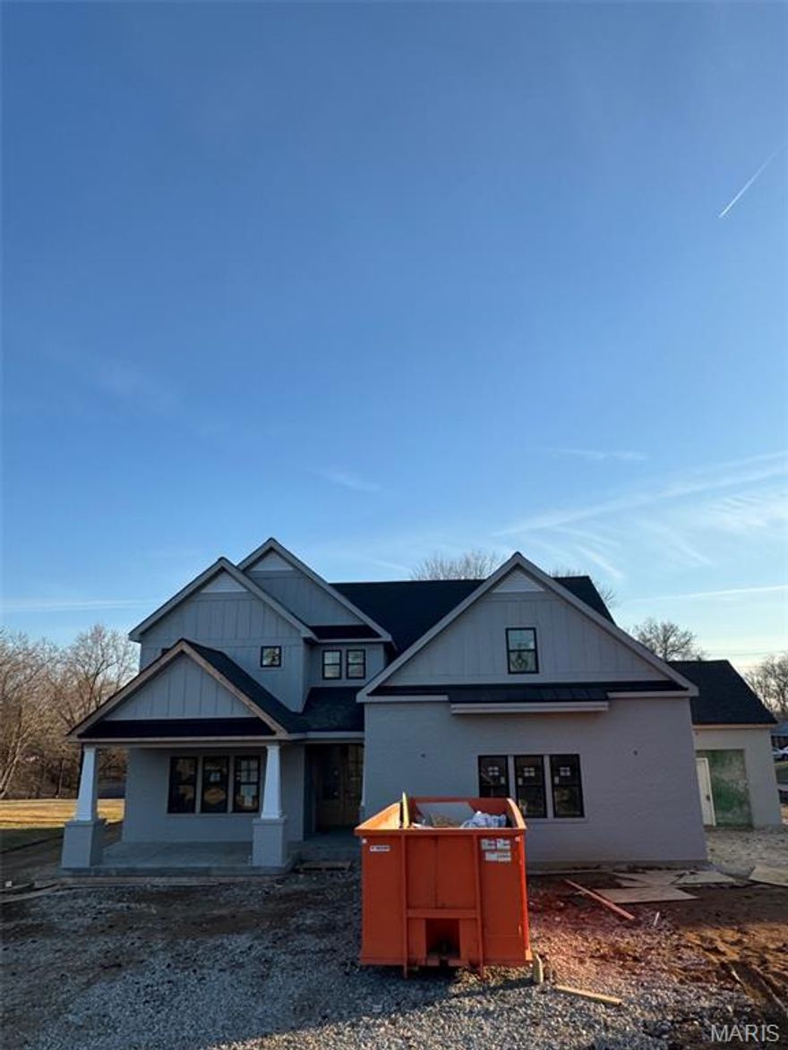 This stunning 5-bedroom, 4.5-bath home is currently under construction by Boulevard Custom Homes. Crafted with impeccable attention to detail and top-tier finishes. Enjoy the convenience of a 3-car attached garage and the grandeur of 9' first-floor ceilings with 8' solid core doors. Luxurious hardwood flooring graces the 1st floor and 2nd-floor hall. The gourmet kitchen boasts custom cabinetry, a large island, peninsula counter, Quartz countertops, soft-close drawers, pull-out spice rack, trash pullout, stainless steel appliances, under-cabinet lighting, and a spacious walk-in pantry. The great room stuns with a 12' beam ceiling and fireplace. Relax in the elegant master suite with a spa-like bath, walk-in closet, adult-height vanities, and standalone tub. Additional features include a 1st-floor mudroom, wood staircase treads, large 2nd-floor bedrooms with walk-in closets, spacious bonus room and a finished lower level with a rec room, bedroom, and full bath.