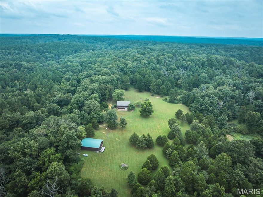This is a rare opportunity to own a charming cabin on 160 acres with direct access to thousands of acres of public land in Shannon County, MO. Surrounded on two sides by Mark Twain National Forest, this secluded retreat is ideal for hunting, hiking, and outdoor recreation. The land features mature hardwood timber, small open areas perfect for food plots, and two ponds that attract abundant wildlife, including deer and turkey.
A 3-bed, 2-bath cabin with full walkout basement sits tucked in a peaceful clearing. The partially finished basement offers space for customization. Enjoy quiet mornings on the covered front porch overlooking a park-like setting. Additional features include a detached garage/workshop with concrete floor, propane backup generator, and easy access via a well-maintained county road and private drive through National Forest.
Whether you're looking for a hunting retreat, weekend getaway, or secluded homestead, this property offers unmatched privacy, natural beauty, and endless potential. Give me a call today for your private tour!