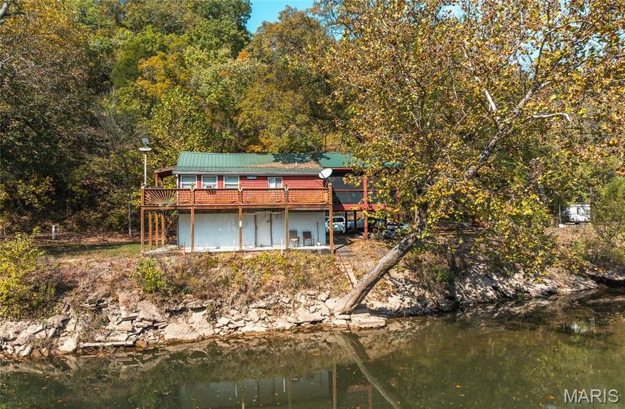 Welcome to your private river retreat just 5–10 minutes from Cuba, Missouri. This 2.84-acre gem sits along the pristine Meramec River, offering incredible floating, swimming, and fishing opportunities—catch largemouth and smallmouth bass right from the riverbank or a canoe. The property features a charming 1-bedroom, 1-bath log cabin with a durable metal roof, completely remodeled with new flooring, fresh paint, and thoughtful updates throughout. A full basement provides excellent storage space. Step outside and take in the peaceful surroundings from the wrap-around porch, including a beautifully covered and screened-in area—perfect for grilling, relaxing evenings, or simply listening to the gentle trickle of the river. A stairway leads directly down to the water, making fishing and swimming effortless. Private and secluded, this setting offers true tranquility with abundant deer and turkey frequently seen in the area. An additional foundation next door provides the opportunity to build a guest cabin, shop, or extra storage building if desired. Whether you’re looking for a weekend getaway, vacation rental, or full-time riverside escape, this Meramec River property delivers unmatched natural beauty, recreation, and relaxation.