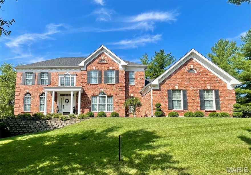 ABSOLUTELY GORGEOUS! Beautifully updated two story home in Chesterfield’s prestigious Greystone blends timeless elegance with modern luxury. A dramatic two-story foyer with T-staircase & custom millwork sets the tone. Enjoy a sophisticated study, elegant formal dining room with wainscoting & a gourmet kitchen featuring 42” white cabinets, granite counters, stainless appliances & gleaming hardwood floors. The spacious great room with gas fireplace opens to a fabulous paver patio--perfect for entertaining. The luxurious primary suite offers a coffered ceiling, large custom closet & spa-like bath with soaking tub & dual vanities. The finished walk-out lower level includes a theater room, rec room, 5th bedroom (currently a gym) & full bath. Add’l features include main floor laundry, zoned HVAC & 3-car garage. This exquisite home offers unparalleled quality in one of Chesterfield’s most sought-after communities. Welcome to elevated living in Greystone.