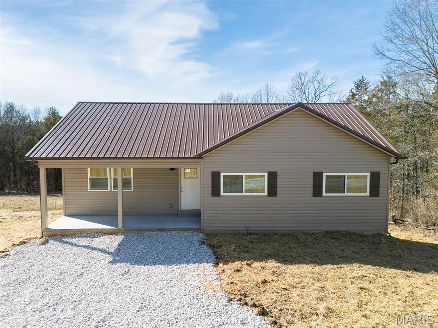 It’s your lucky day! Buyer financing fell through and this property  is avail for You!!   Welcome to this brand-new construction ranch set on a 1.56-acre private lot, offering the perfect blend of seclusion and convenience. Tucked down a private drive yet just minutes from shopping and highway access, this home delivers peaceful living without sacrificing accessibility. Step onto the large covered front porch and into an inviting, open-concept layout featuring luxury vinyl plank flooring throughout the main level. The spacious great room and kitchen combo creates an ideal space for everyday living and entertaining. The kitchen includes ample cabinetry and easy access to the main-floor laundry.
A large deck extends your living space outdoors, overlooking the expansive yard and surrounding privacy.
The primary bedroom offers a walk-in closet and a private bath with a large walk-in shower. Two additional bedrooms share a full hall bath. The walkout lower level is ready for your finishing touches—ideal for future living space, a workshop, or storage.
1 year Builder warranty and a 2/10 warranty systems and structural
Outside, you’ll find a separate oversized 1-car garage, plus plenty of room to build an additional outbuilding if desired. With NO HOA, you have the freedom to make this property truly your own. This private, peaceful setting paired with new-construction convenience makes this home an exceptional opportunity.