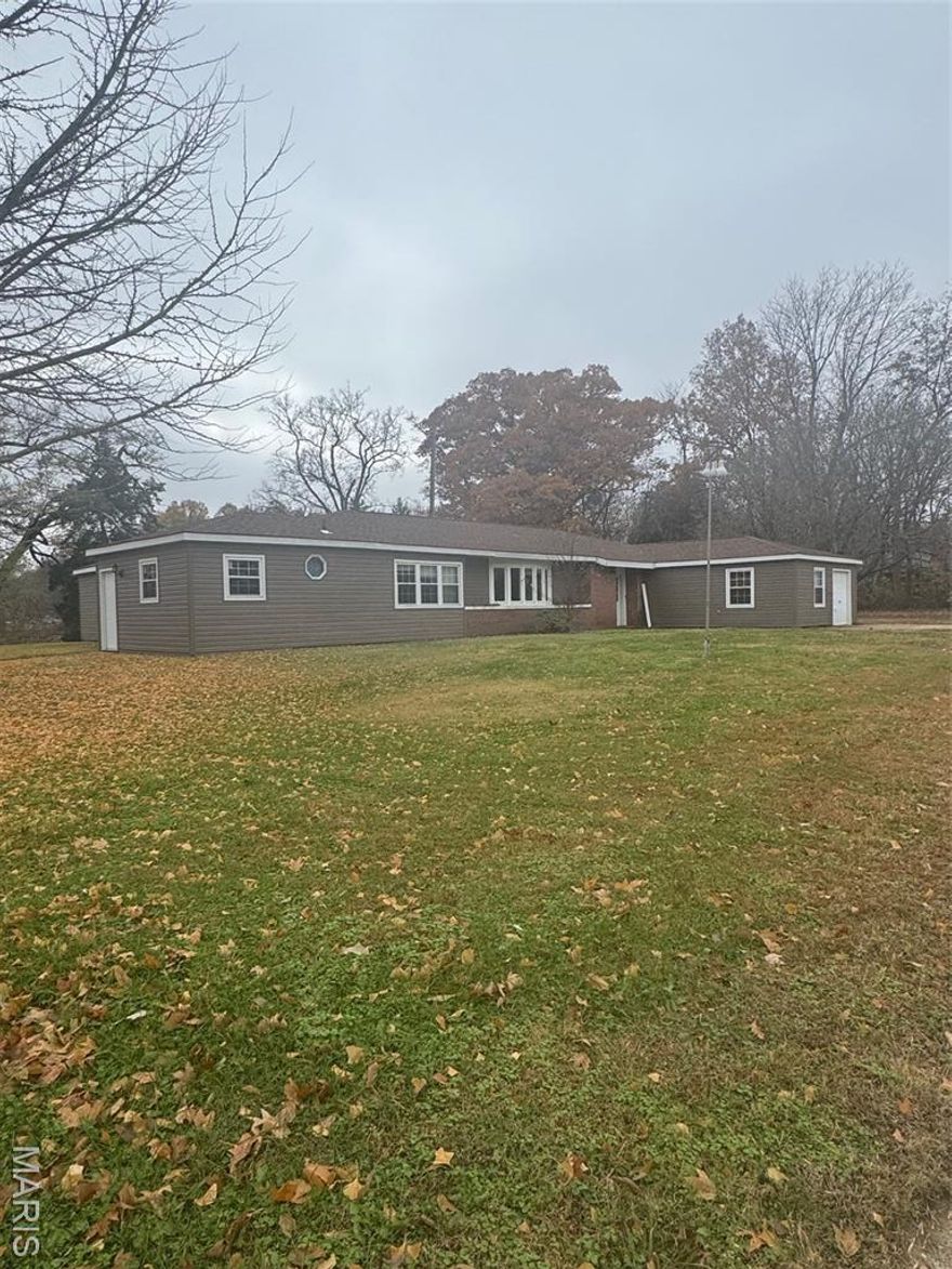Historical home with lots of history behind the building of this home. Interior of the home has been decorated with wood from all over the world. Nice hardwood floors and tile. The home boasts 2977 sq. ft. on one level. There are 4 bedrooms and 3 baths. Closets are lined with cedar. Master bath has jacuzzi tub and shower. The lady of the home will love this large kitchen with large pantry and alcove for kitchen table. Kitchen has gas range, plus a gas cooktop, double wall oven and lots of cabinets and counter space. Large utility room lots more cabinets and counter space. Home has a 19 x 19 storage room attached to the home. The 2 car carport is attached to the home. There is a detached garage/workshop that has a kitchen area and a bathroom. There a re 2 garage storage spaces with built in shelving for all the tools. Must see to appreciate this home.