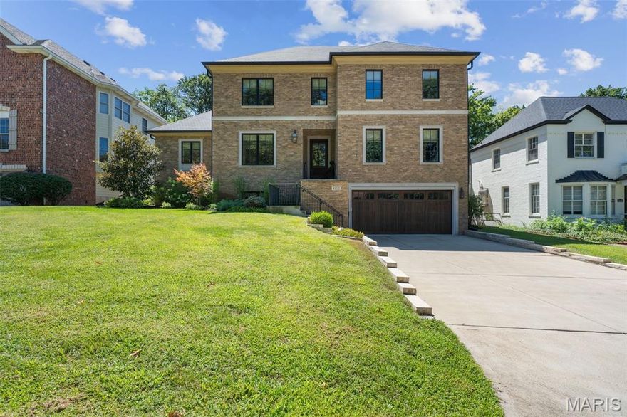 This gorgeous home masterfully blends modern design and traditional function. Featuring 4 spacious bedrooms and 4.5 luxurious baths, this home impresses at every turn with high-end finishes, rich architectural detail, and an effortlessly livable floor plan. Step into the sophisticated den/office, wrapped in dramatic navy millwork and grounded by warm hardwoods, where style meets serenity. The open-concept dining and great rooms flow seamlessly with designer lighting, custom trim, and an abundance of natural light pouring through large windows and French doors. The chef’s kitchen and adjacent breakfast area overlook the beautifully landscaped backyard where you can relax in the outdoor covered veranda complete with fireplace or the adjacent pergola covered patio with outdoor kitchen. The first-floor primary suite is a true retreat, complete with a walk-in closet and a spa-inspired ensuite bathroom. Upstairs, the three additional bedrooms are generously sized with ample closet space and beautifully updated bathrooms. Enjoy modern living in a classic setting — just minutes from Clayton, parks, schools, and all that University City has to offer.