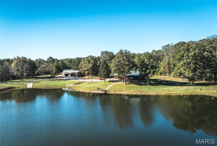 CLIFFS LAKE--A SPORTMANS PARADISE

Discover your own private retreat on this remarkable 210-acre property located just outside Fredericktown, Missouri. This one-of-a-kind estate combines natural beauty, privacy, recreation, and comfort in an unmatched setting. The land features a stunning 10-acre stocked lake with a private dock and boat ramp — the perfect spot to fish for crappie, bass, bluegill, and catfish or simply enjoy the peaceful view across the water.

A handcrafted red cedar log cabin rests near the lake, offering warmth and character with its rustic charm and stone flue wood-burning furnace. The cabin provides a comfortable getaway for weekends or extended stays and blends beautifully with the surrounding forest and rolling hills. Power and utilities are already in place, including underground electric service, a deep well, and a septic system — offering the convenience and functionality needed for year-round use.

Outbuildings include a large 30x60 shed equipped with power and water, ideal for storing equipment, boats, and ATVs, plus a separate machine shed for tractors or additional storage. The property has an excellent internal road system, making it easy to access all areas — from the open fields and food plots to the wooded ridges and the lakefront.

This land has been carefully managed and enjoyed by the same family for more than 25 years as a dedicated deer, turkey, and fishing property. The established food plots and natural cover create an ideal habitat for wildlife. Deer and turkey populations are abundant, and the layout of the land provides excellent hunting opportunities in multiple locations. Whether you’re an avid outdoorsman, a conservation enthusiast, or simply looking for peace and privacy, this property delivers everything you could want in a recreational farm or weekend retreat.

The terrain offers a mix of food plots, mature timber, and scenic wooded draws, giving the land both beauty and versatility. With plenty of road frontage and several ideal building sites overlooking the lake and surrounding countryside, the possibilities are endless. Create your dream home, expand the existing cabin, or develop a family compound where generations can enjoy outdoor recreation together.

Other highlights include established internal trails and roadways throughout the property, making it easy to explore on foot, horseback, or ATV. Underground electric ensures clean, unobtrusive access to power, while the deep well and septic system support comfortable off-grid living. The large lake not only provides excellent fishing but also serves as a beautiful centerpiece for the entire property — a peaceful setting for boating, swimming, or relaxing by the water’s edge.

Properties of this size and quality are extremely hard to find. Whether your vision is a hunting lodge, private estate, or recreational getaway, this property offers everything in place to make it your own. With a proven history of exceptional deer and turkey hunting and fishing that has been enjoyed for decades, it’s ready for new memories to be made.

If you’re looking for a secluded property with water, wildlife, and all the amenities already established — look no further. This 210-acre Missouri retreat has it all: a 10-acre lake, a charming red cedar log cabin, multiple outbuildings, excellent infrastructure, and a pristine natural landscape ready to enjoy.