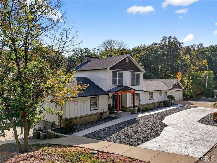 Freshly Painted!  Beautiful 1.5-story waterfront home in the gated lake & golf community of Raintree Plantation! Step inside to hardwood floors and a soaring great room with a floor-to-ceiling stone fireplace flanked by windows that fill the space with natural light. The remodeled kitchen features stainless appliances, quartz counter tops, granite center island, custom cabinets, and vinyl plank flooring. A spacious loft overlooks the main level. The primary suite offers a walk-in closet, soaking tub, and separate shower. Finished walkout lower level includes 2 bedrooms (both with walk-in closets), full bath, storage, and family room. Enjoy stunning lake views from the atrium/bay door leading to expansive new composite deck, perfect for entertaining. Exterior highlights include a circle drive, portico entry, large front and back patios, stone retaining walls, hot tub and private lake front gazebo with spectacular lake front views. Bonus: 3rd tuck-under garage space, main floor laundry, private golf cart path from home to lake and corner lot with loads of extra parking. Resort-style living at its best! MOTIVATED SELLER!! Seller says Bring Us An Offer..